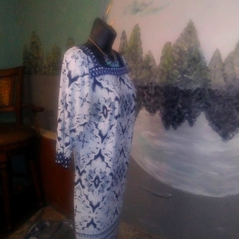 Woman's white and blue knee length dress